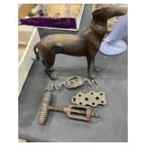 Bronze dog statue, metal corkscrew bottle opener,