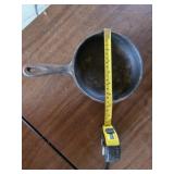 Unmarked cast iron skillet