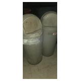 2 tan industrial trash bins
