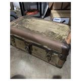 canvas-and-leather-trimmed steamer trunk