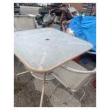 outdoor metal patio set with a square glass-top