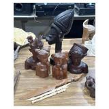 hand-carved wooden Balinese busts, sculptures,