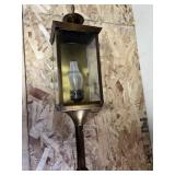 brass carriage or coach-style wall lantern