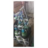 6 used oxygen tanks with carrier