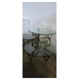 Wrought iron scroll style round glass top table