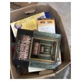 Box filled with office supplyï¿½s and sheet