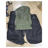 green vinyl garment bag, black American Tourister
