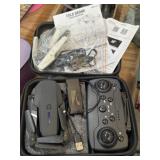 Fold drone with accessories in zip up case
