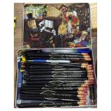 Holiday tin of advertising pens and pencils