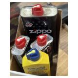 4 partial cans of lighter fluid