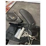 Two hand gun  holsters and compact gun cleaning