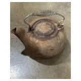 Cast iron tea kettle with swivel lid