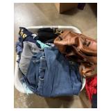 Basket of used clothes, and leather brown BOc bag