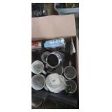 Coffee mugs , and cheese grater