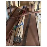 Surveyors transit, two man cross cut saw and