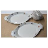 Two Cordon Bleu baking dishes & stack of bowls