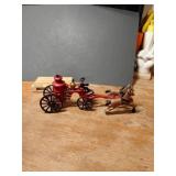 CAST IRON FIREMAN AND HORSES IN GREAT CONDITION