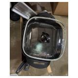 Assortment of pots and pans with lids, used with