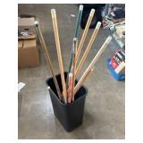 Various pool cues, most need new tips