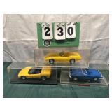 (3) Assorted Corvette Cars In Display Cases Lot 8