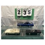 (3) Assorted Corvette Cars In Display Cases Lot 13