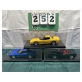 (3) Assorted Corvette Cars In Display Cases Lot 30