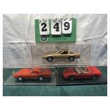 (3) Assorted Corvette Cars In Display Cases Lot 27