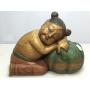 Carved wooden statue. Child and squash.