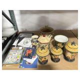 Ceramic canisters, assorted books, matted photos