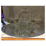 Oval mirror and metal display stand. Mirror is