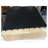 Interlocking Garage floor covering tiles. In box.