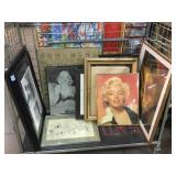 Cart of framed photos of Marilyn Monroe, cherubs