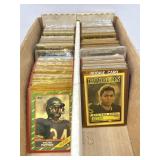Large lot of mixed sports cards in cases with