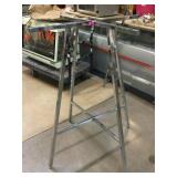 2 Metal round clothing racks bases, missing top,