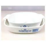 2 Corning Ware casserole dishes.