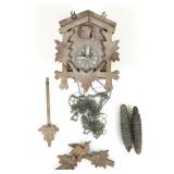 Wood cuckoo clock with weights. Approx 6x6x5