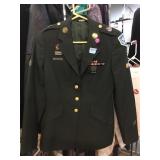 Woman Military jacket with pins and patches.