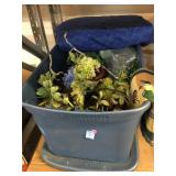 Decorative faux flowers and garland. Bin has lid
