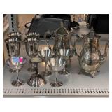Teapots, goblets, plated cups.