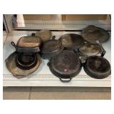 Cast iron pans and skillets. Some marked. One is