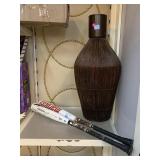 Wicker floor vase and 2 metal baseball bats.