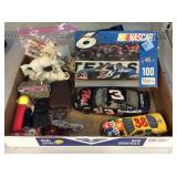 NASCAR puzzle, model cards, ceramic unicorn, and
