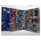Star Trek collector cards and prints in binder.