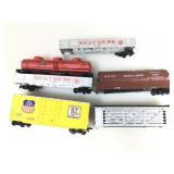 5 assorted train cars. HO scale.