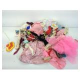 Assorted doll clothes and accessories.