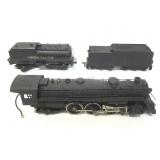 Engine, coal and tanker model train cars.