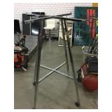 Metal clothing rack, missing wheels, 36x36x53in Metal clothing rack, missing wheels, 36x36x53in