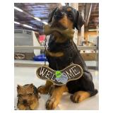 Sitting welcome dog sign and Yorkie dog figurine.
