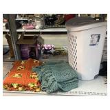 Crocheted blankets and Sterilite Plastic laundry