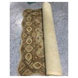 Wavy edge rug. Rolled. 58in wide. Needs cleaning